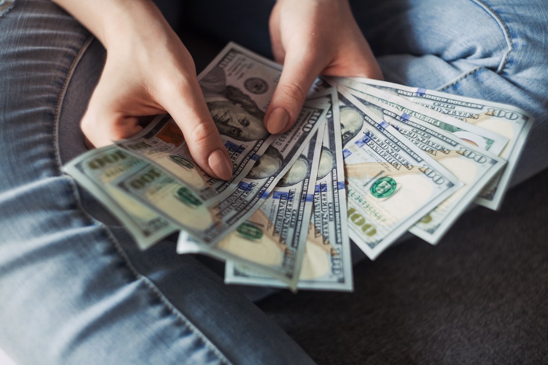 our-story Girl holding American Dollar Bills